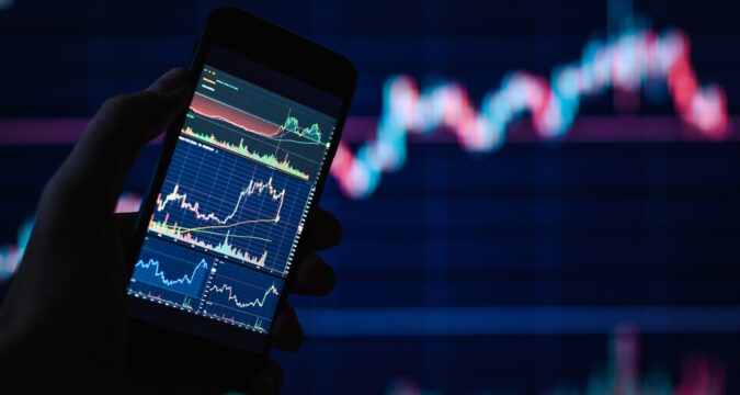 BackgroundOnAFinancialThemeTraderChartsOnSmartphoneSelective | Cryptocoin Stock Exchange Revue de Novatradecore.com (Novatradecore) – La Plateforme de Trading Crypto la Plus Fiable