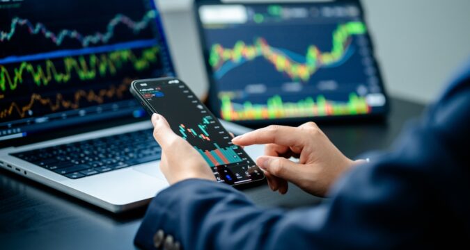 InvestorsAnalyzeTheDataStockMarketIndexViaSmartphoneScreen | Cryptocoin Stock Exchange IGW Management Review, Igwm.info – Is IGW-Management Scam or a Good Broker?